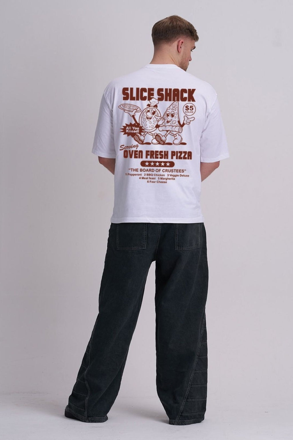 Person wearing a white t-shirt with 'Slice Shack' pizza-themed design on the back, standing against a plain background.