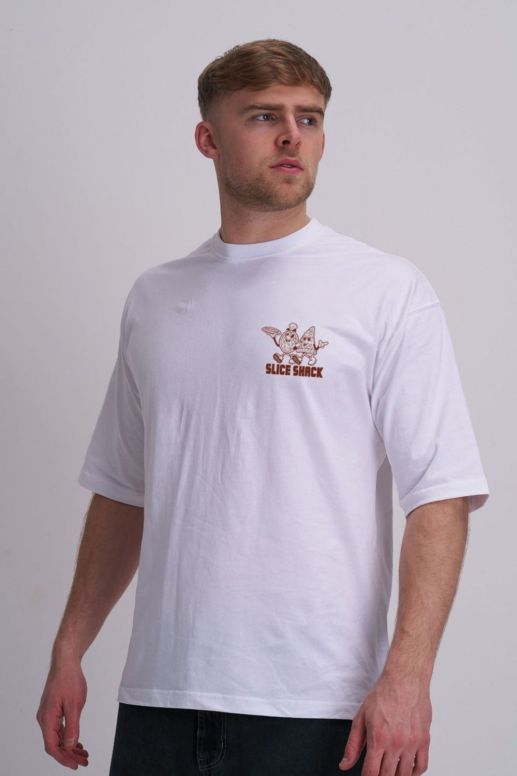 Man wearing a white t-shirt with a pizza logo on a plain background