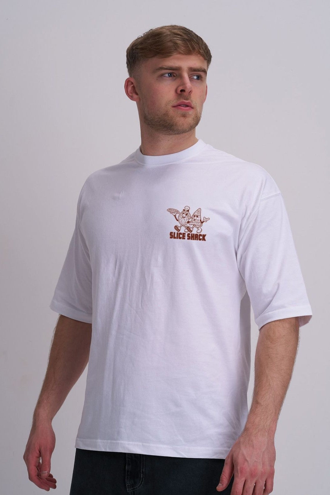 Man wearing a white t-shirt with a pizza logo on a plain background