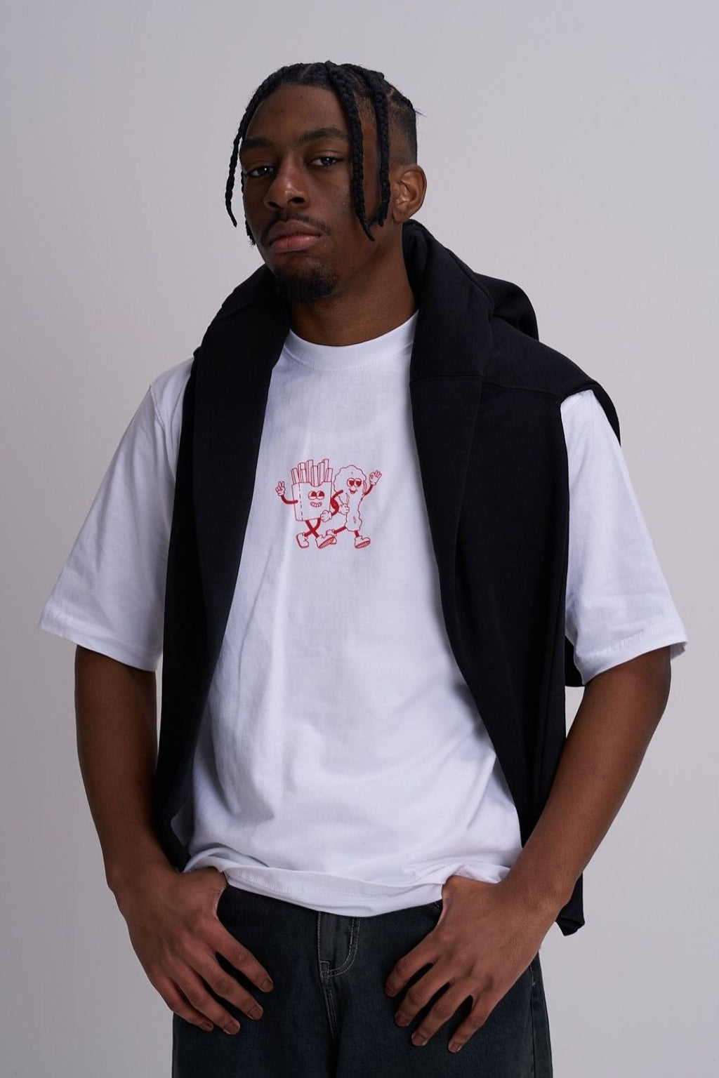 Male wearing a white tee with logo fast food graphic and black hoody