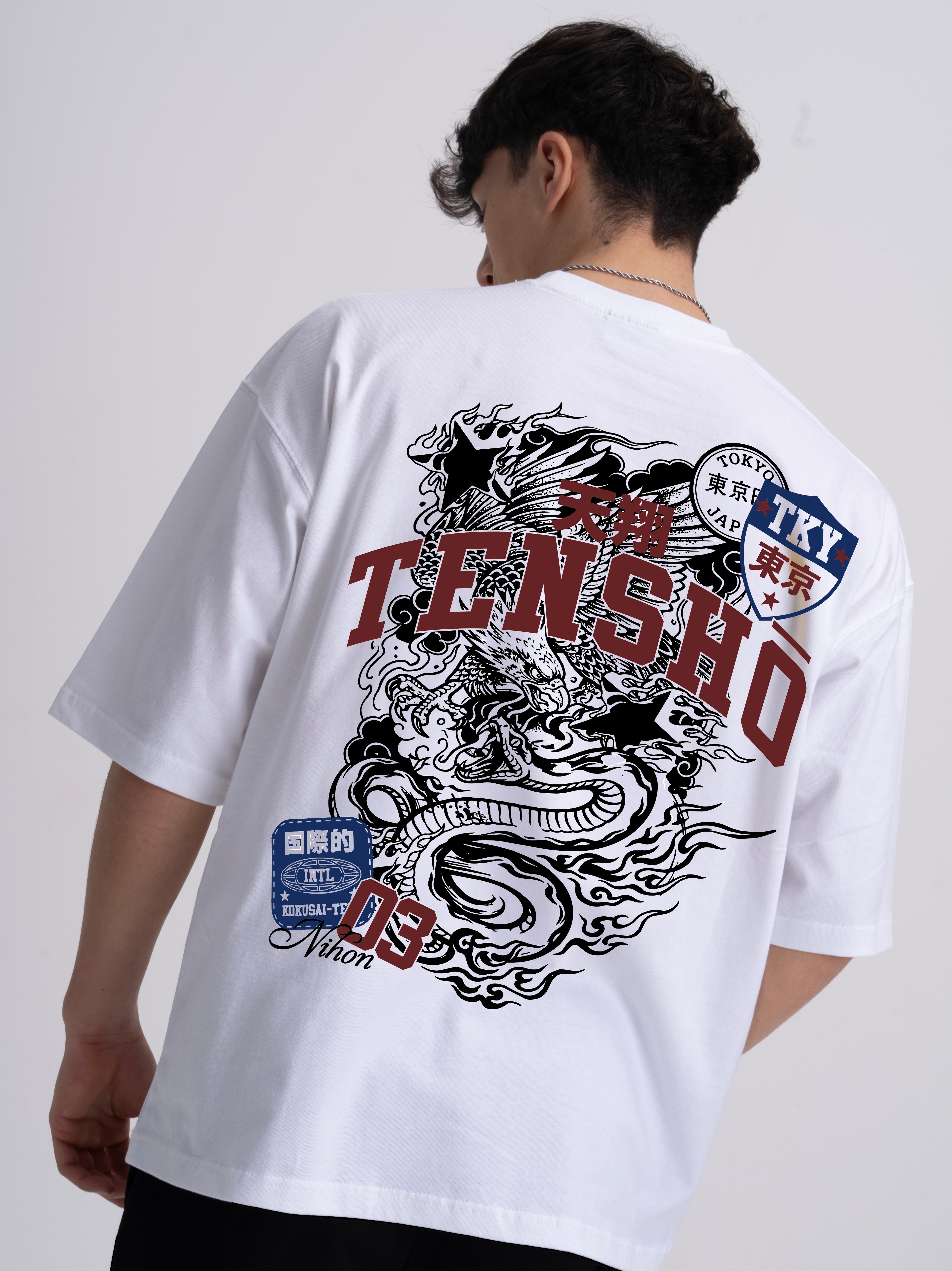 Male wearing a white t-shirt with a Japanese dragon design and Tensho text on the back
